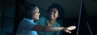 Two women discussing healthcare website design